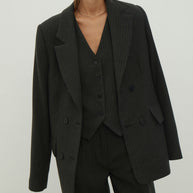 Double-breasted woolen jacket in a gray-green stripe