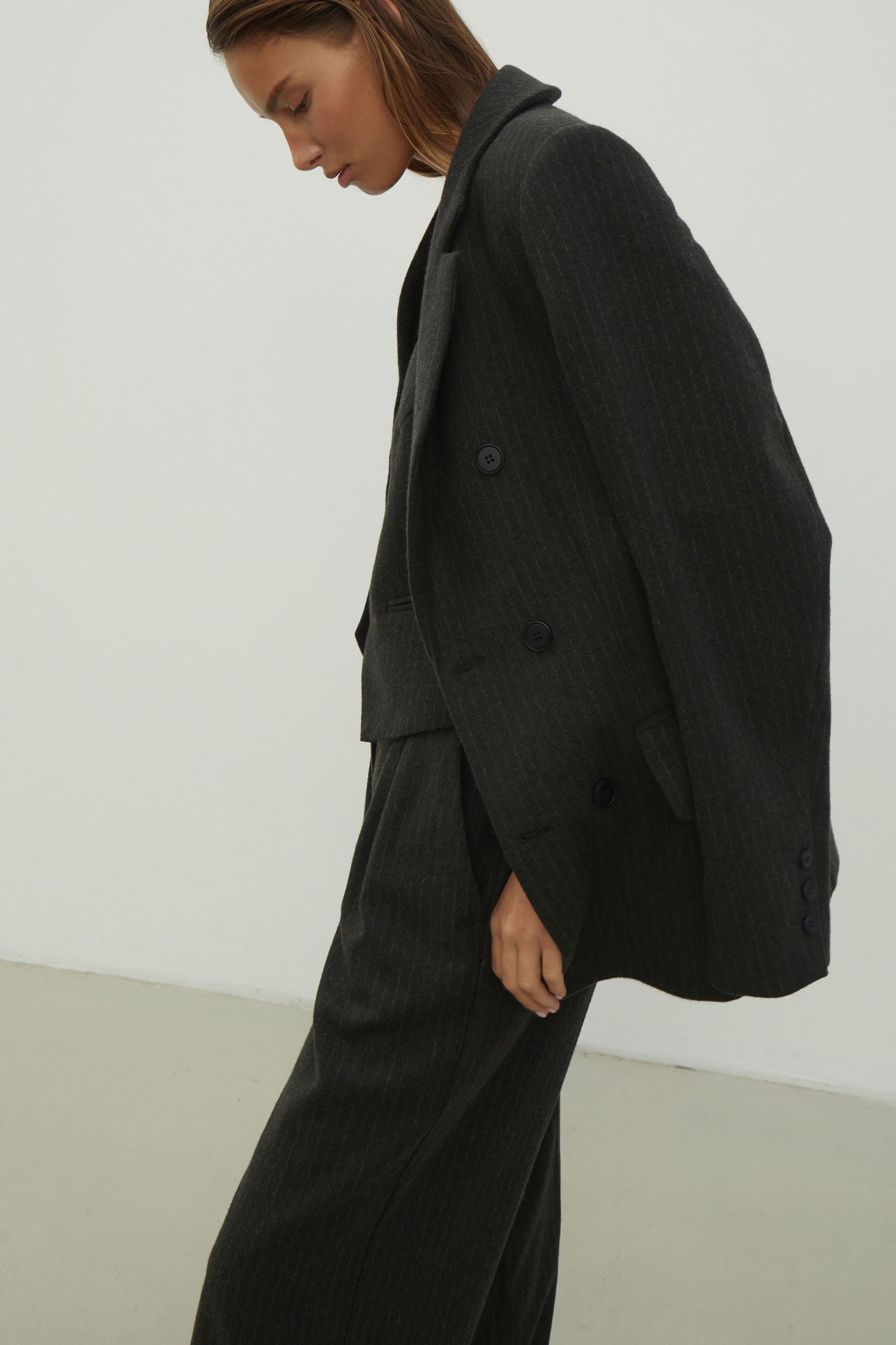 Double-breasted woolen jacket in a gray-green stripe