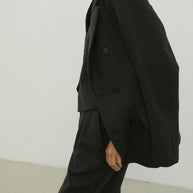 Double-breasted woolen jacket in a gray-green stripe