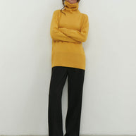 Knitted sweater with a voluminous neck