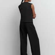 Palazzo pants with double tucks in gray/black
