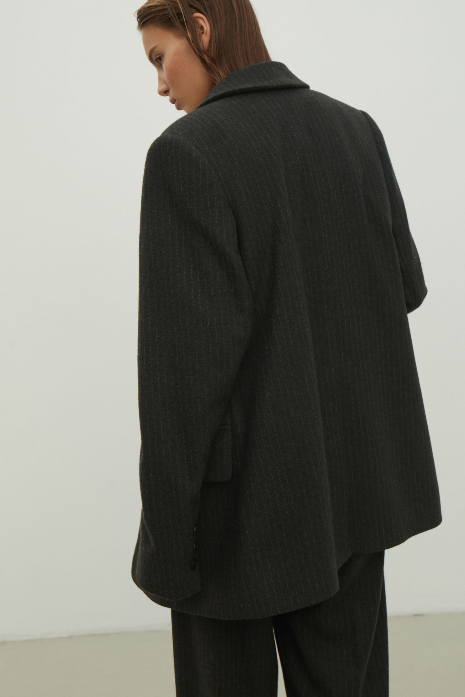 Double-breasted woolen jacket in a gray-green stripe