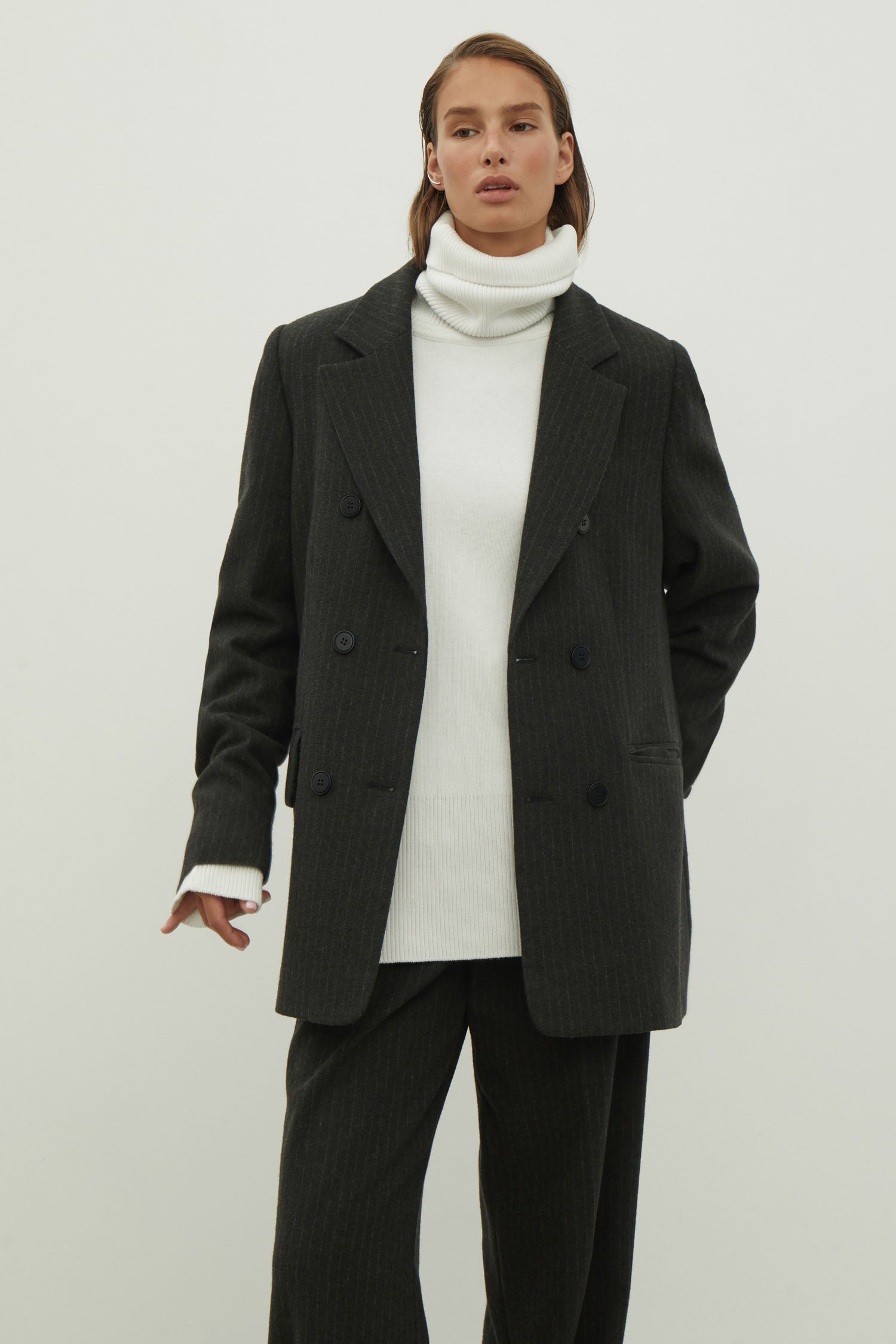 Double-breasted woolen jacket in a gray-green stripe