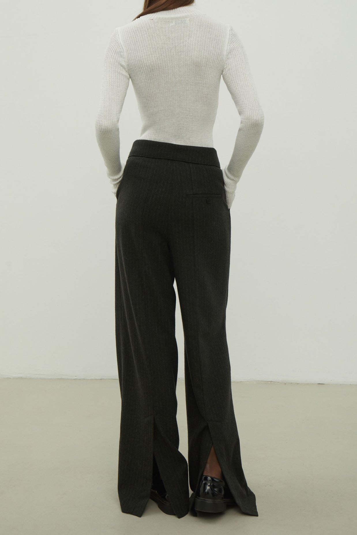 Woolen palazzo pants with a decorated belt in dark gray