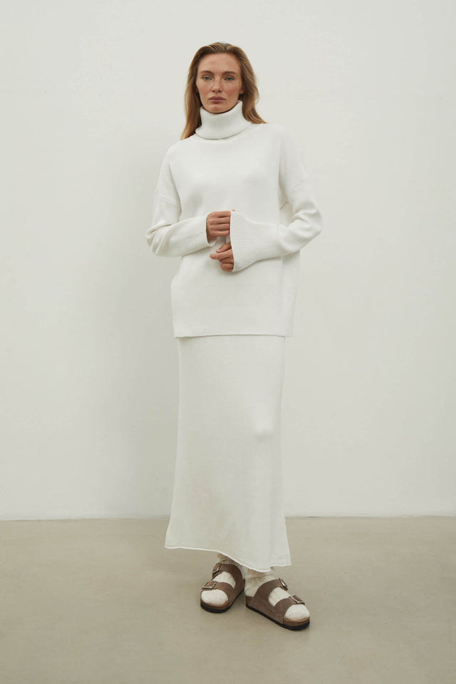 Knitted sweater with a voluminous neck