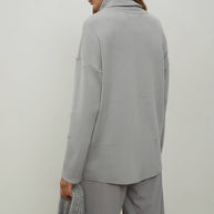 Knitted sweater with a voluminous neck