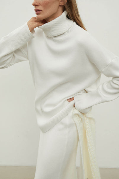 Knitted sweater with a voluminous neck