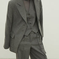 Single-breasted woolen jacket with a tie in gray