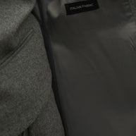 Single-breasted woolen jacket with a tie in gray