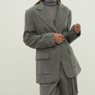 Single-breasted woolen jacket with a tie in gray