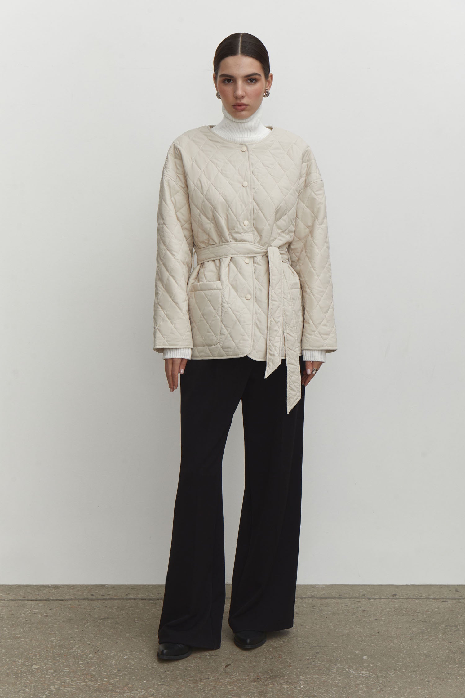 Quilted jacket with a belt