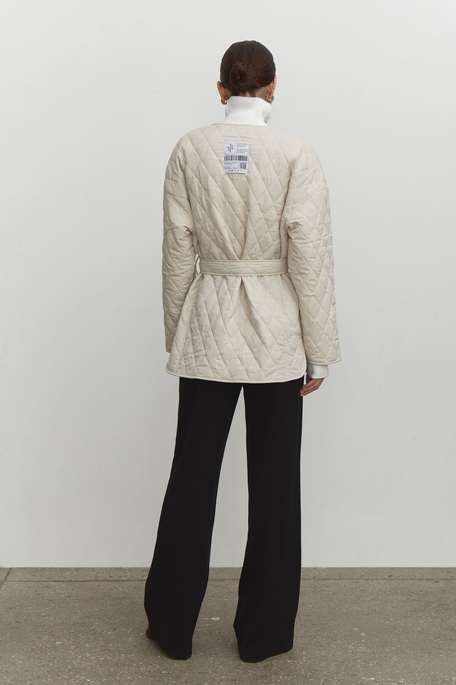 Quilted jacket with a belt
