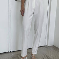 Pants with tucks