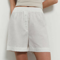 Oversized linen shorts with buttons