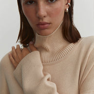Knitted sweater in olive/cream